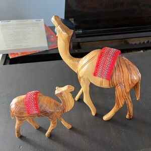 Handmade Olive wood camels with woven cloth hump cover. Set of 2: 8”tall, 6”tall